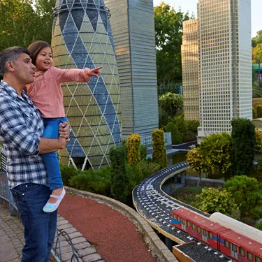 Father and girl pointing at London landmarks in Miniland at the LEGOLAND Windsor Resort