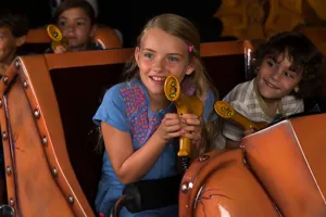 Children holding laser blasters in Laser Raiders at the LEGOLAND Windsor Resort