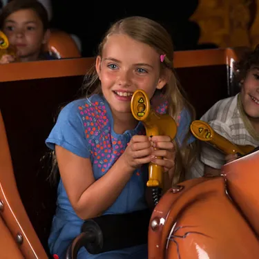 Children holding laser blasters in Laser Raiders at the LEGOLAND Windsor Resort