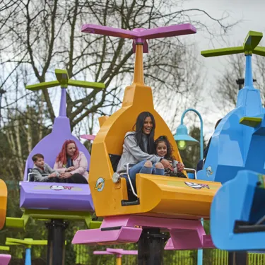 Mother and girl laughing on DUPLO Valley Airport