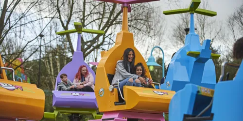 Mother and girl laughing on DUPLO Valley Airport