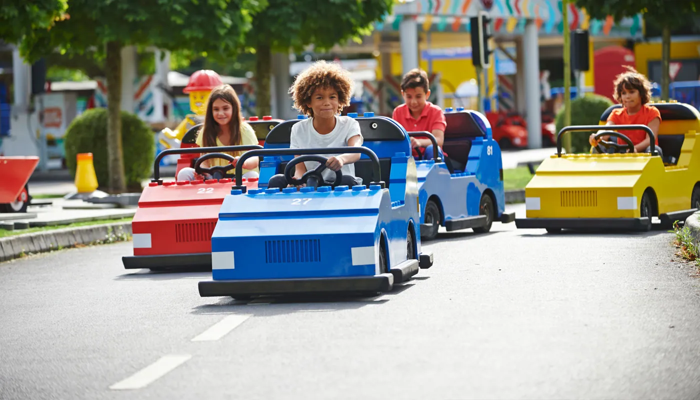 Children driving cars at LEGO® City Driving School at LEGOLAND® Windsor Resort