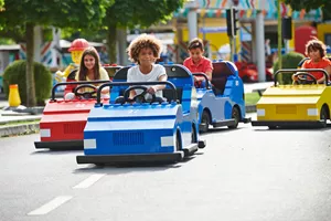 Children driving cars at LEGO® City Driving School at LEGOLAND® Windsor Resort