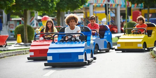 Children driving cars at LEGO® City Driving School at LEGOLAND® Windsor Resort