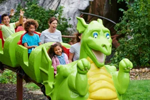 Families smiling on Dragon's Apprentice at the LEGOLAND Windsor Resort