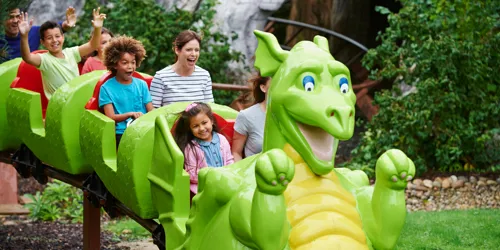 Families smiling on Dragon's Apprentice at the LEGOLAND Windsor Resort