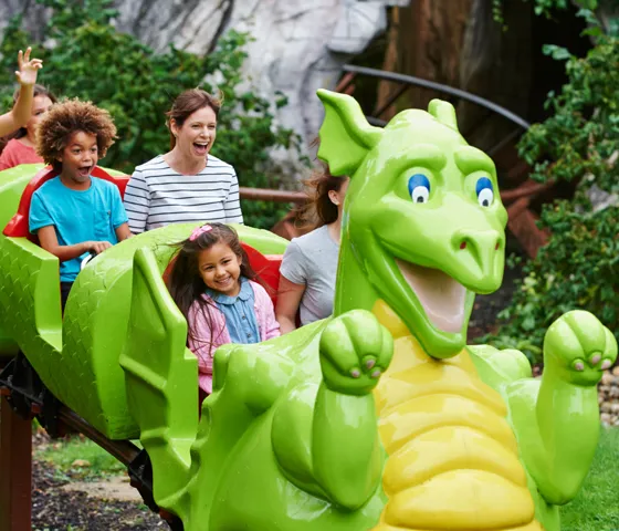Families smiling on Dragon's Apprentice at the LEGOLAND Windsor Resort