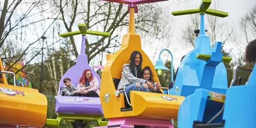 Mother and girl laughing on DUPLO Valley Airport