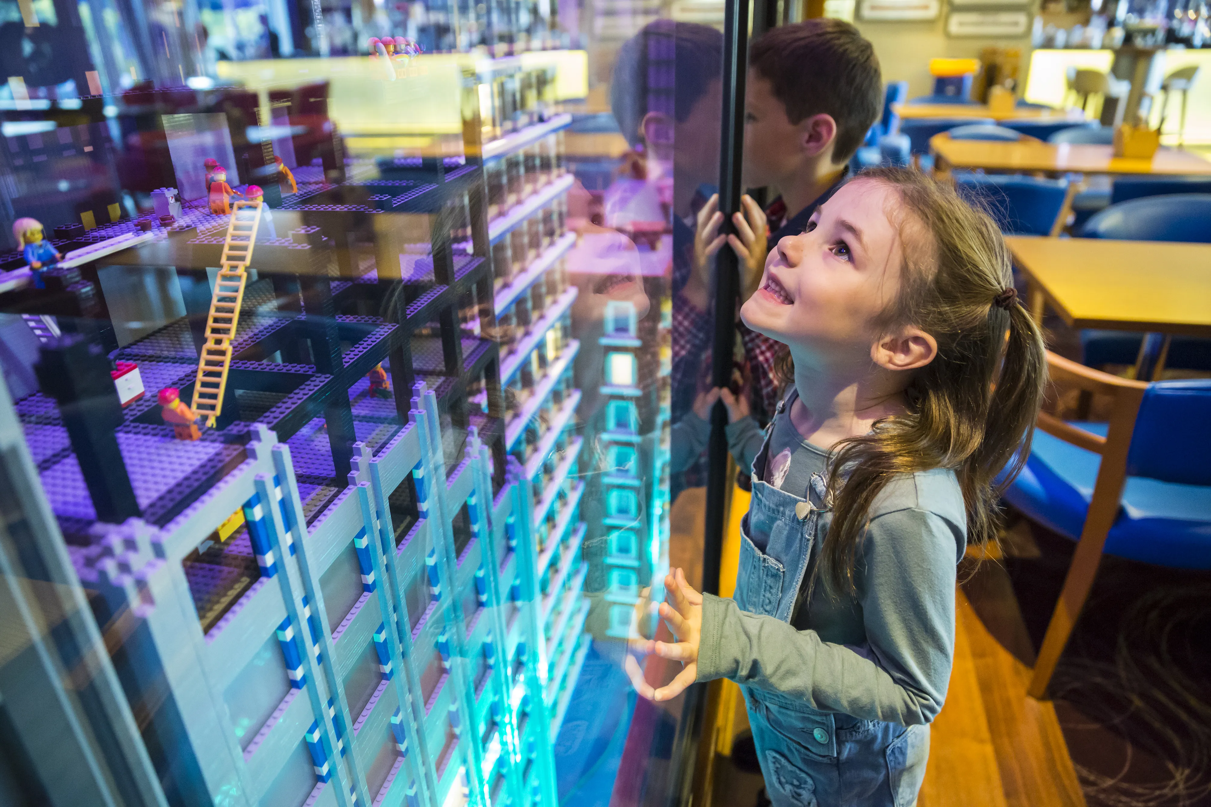 Girl looking at LEGO model in Skyline Bar