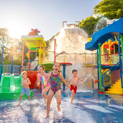 Kids laughing and playing in water at Drench Towers at LEGOLAND Windsor